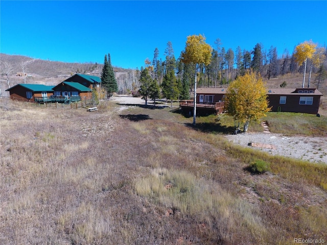 view of yard featuring a deck and a rural view