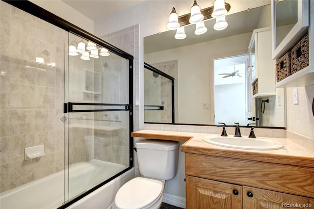 full bathroom with toilet, vanity, and shower / bath combination with glass door