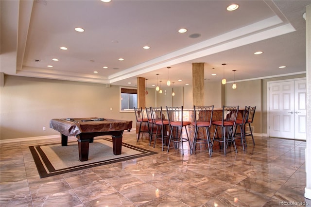 rec room with billiards, bar, a tray ceiling, and ornamental molding