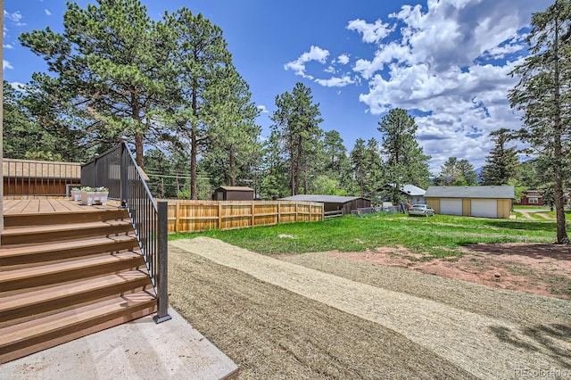 211 E Pikes Peak Ave, Woodland Park, CO 80863 - view of yard featuring a deck and a detached garage