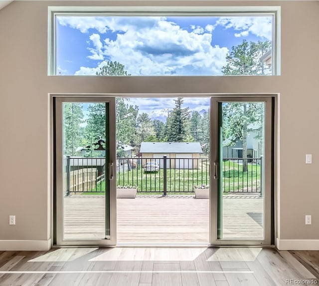 211 E Pikes Peak Ave, Woodland Park, CO 80863 - doorway with plenty of natural light and wood finished floors