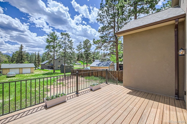 211 E Pikes Peak Ave, Woodland Park, CO 80863 - wooden terrace featuring an outbuilding and a residential view