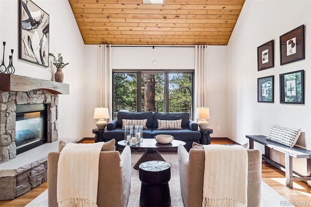 1570 Blakcomb Ct, Evergreen, CO 80439 - living room featuring a fireplace, wooden ceiling, wood finished floors, and high vaulted ceiling
