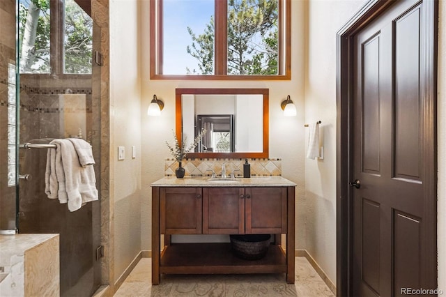 1570 Blakcomb Ct, Evergreen, CO 80439 - full bathroom featuring a stall shower, vanity, baseboards, and a textured wall