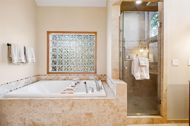 1570 Blakcomb Ct, Evergreen, CO 80439 - bathroom with plenty of natural light, a stall shower, and a bath