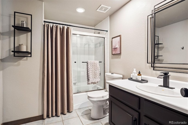 1570 Blakcomb Ct, Evergreen, CO 80439 - bathroom featuring toilet, vanity, combined bath / shower with glass door, a textured wall, and tile patterned flooring