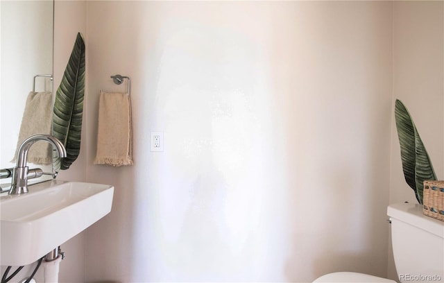 bathroom with a sink and toilet