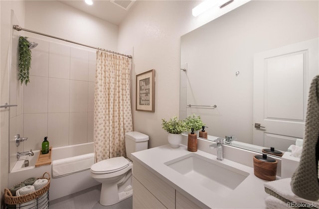 bathroom featuring vanity, toilet, visible vents, and shower / tub combo