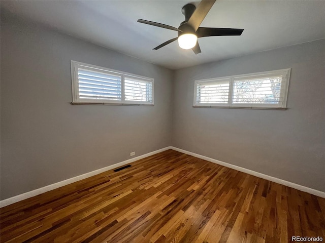 unfurnished room featuring hardwood / wood-style floors and ceiling fan