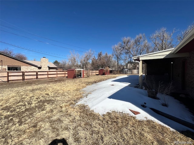 view of yard layered in snow