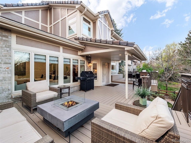 62 N Ranch Rd, Littleton, CO 80127 - wooden deck with a grill and an outdoor living space with a fire pit