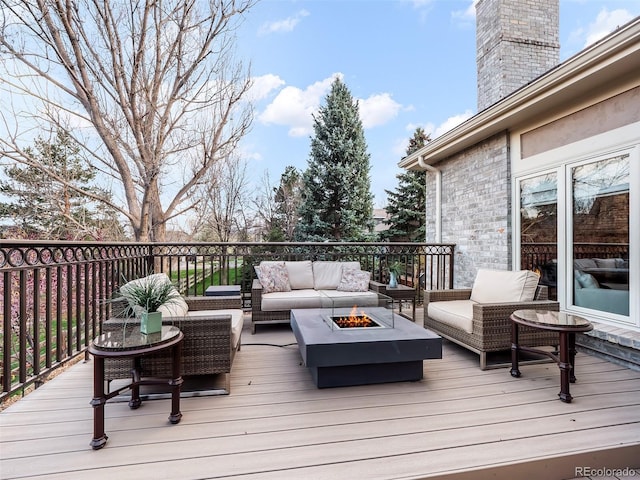 62 N Ranch Rd, Littleton, CO 80127 - deck featuring an outdoor living space with a fire pit