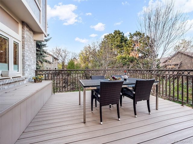 62 N Ranch Rd, Littleton, CO 80127 - wooden deck featuring outdoor dining space