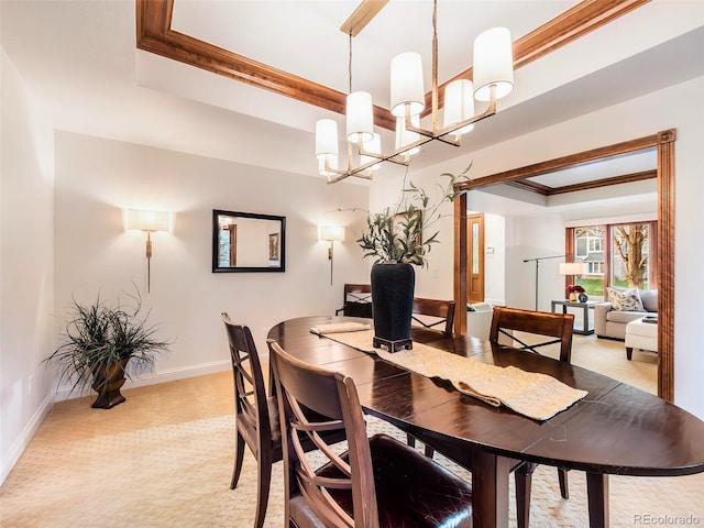 62 N Ranch Rd, Littleton, CO 80127 - dining area with a chandelier, ornamental molding, baseboards, light carpet, and a raised ceiling