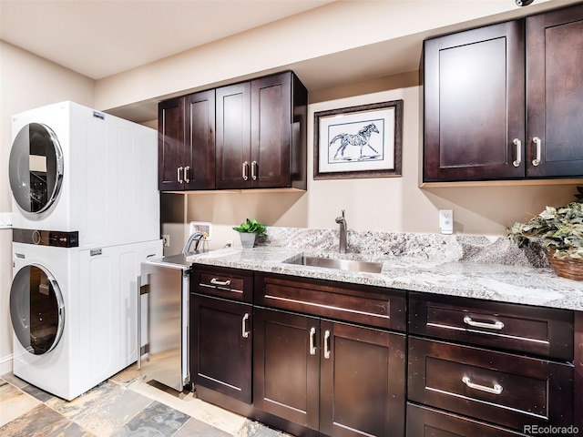 62 N Ranch Rd, Littleton, CO 80127 - laundry area with estacked washer and dryer and cabinet space