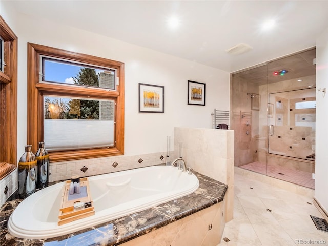 62 N Ranch Rd, Littleton, CO 80127 - full bathroom featuring a stall shower and a garden tub