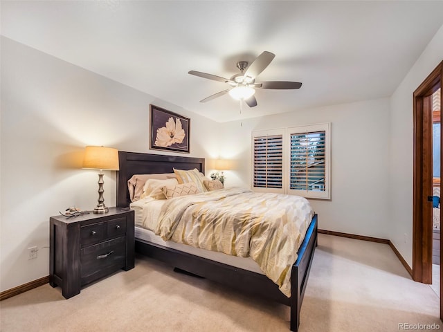62 N Ranch Rd, Littleton, CO 80127 - bedroom featuring light colored carpet, baseboards, and a ceiling fan