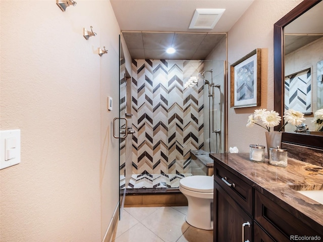 62 N Ranch Rd, Littleton, CO 80127 - full bathroom featuring vanity, a stall shower, tile patterned flooring, toilet, and recessed lighting
