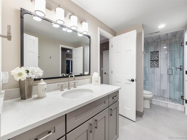 62 N Ranch Rd, Littleton, CO 80127 - full bath with vanity, a stall shower, toilet, and tile patterned floors