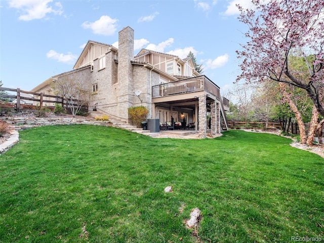 62 N Ranch Rd, Littleton, CO 80127 - back of property featuring a wooden deck, stairway, a chimney, cooling unit, and a patio area