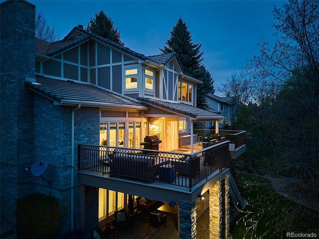 62 N Ranch Rd, Littleton, CO 80127 - rear view of property featuring a tile roof and a chimney