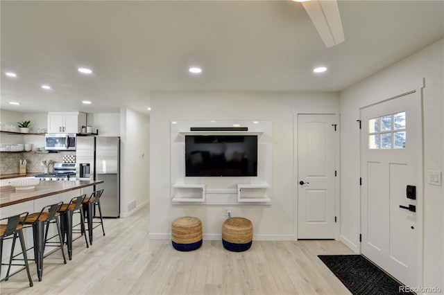 entryway with light wood-type flooring