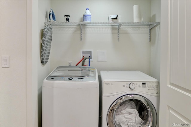 laundry area with washer and dryer