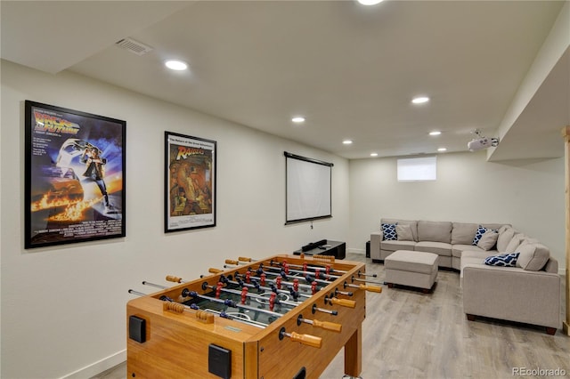 game room with hardwood / wood-style floors