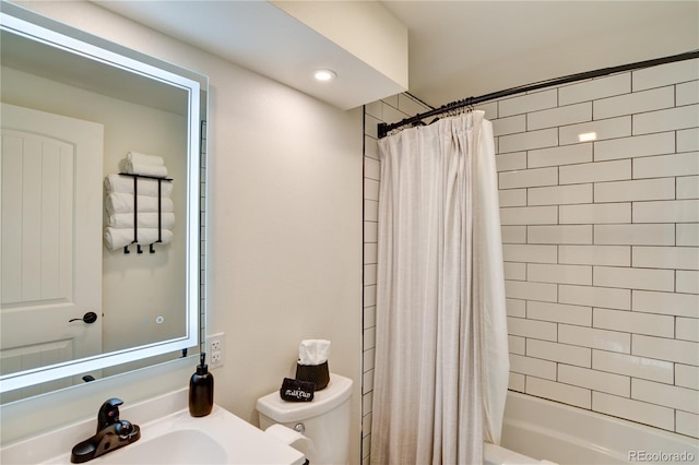 full bathroom with shower / bath combo, sink, and toilet