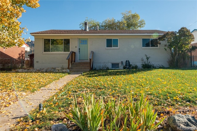 ranch-style house with a front yard