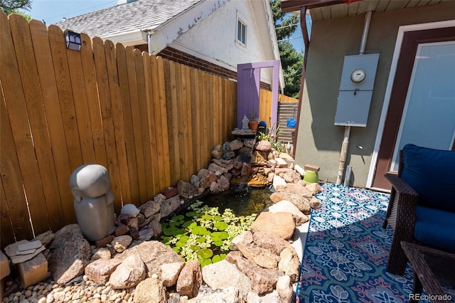 915 N Kearney St, Denver, CO 80220 - exterior view of fence and a garden pond