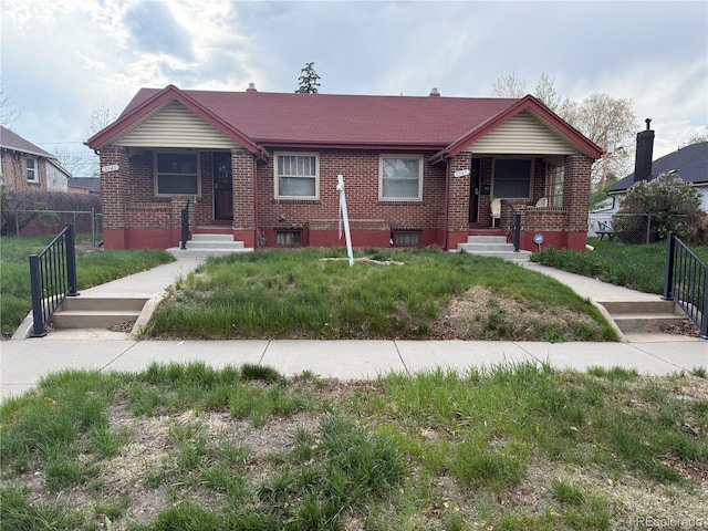 3541-3547 N Clayton St, Denver, CO 80205 - view of front of house featuring brick siding and a porch