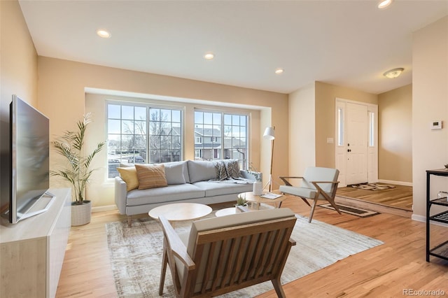 living room with light hardwood / wood-style floors