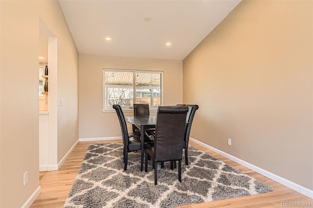 dining space with recessed lighting, wood finished floors, and baseboards