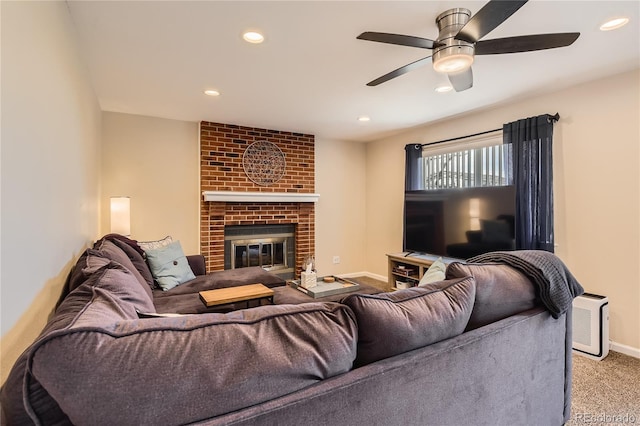 living room featuring ceiling fan, recessed lighting, baseboards, a brick fireplace, and carpet