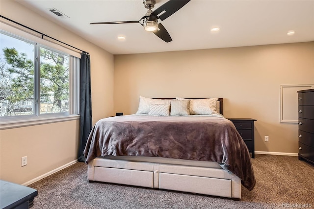 carpeted bedroom featuring recessed lighting, visible vents, and baseboards