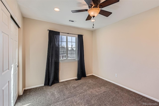 unfurnished bedroom featuring recessed lighting, carpet floors, visible vents, baseboards, and a closet