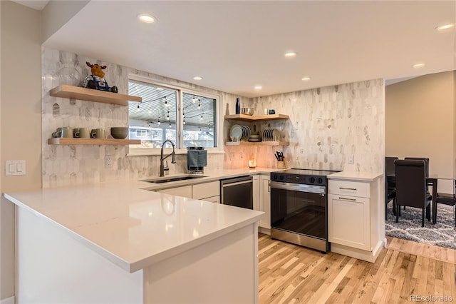 kitchen featuring open shelves, white cabinetry, light countertops, and electric range oven