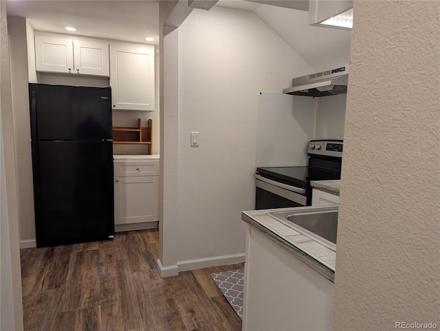 kitchen with electric range, dark wood-style floors, freestanding refrigerator, under cabinet range hood, and white cabinetry