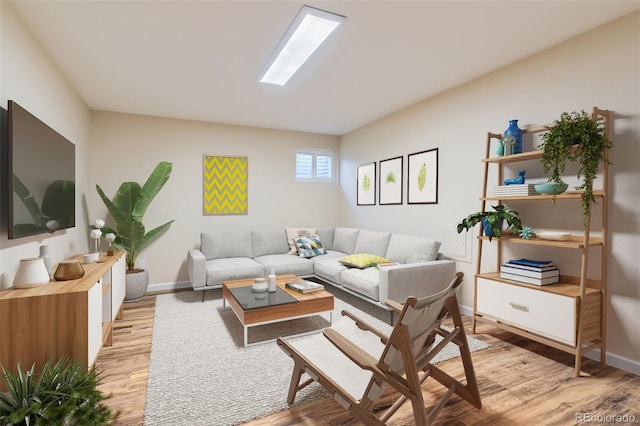 living area featuring light wood-style floors and baseboards