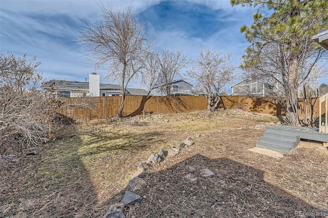 view of yard with a fenced backyard