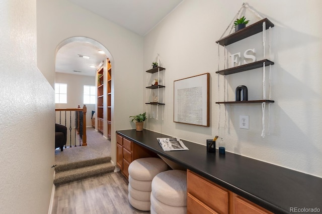 hallway with light hardwood / wood-style flooring