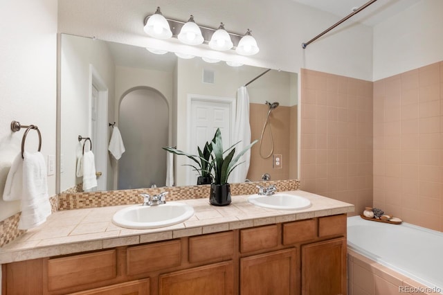 bathroom with vanity and shower / tub combo with curtain