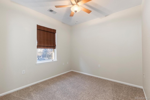 carpeted empty room featuring ceiling fan