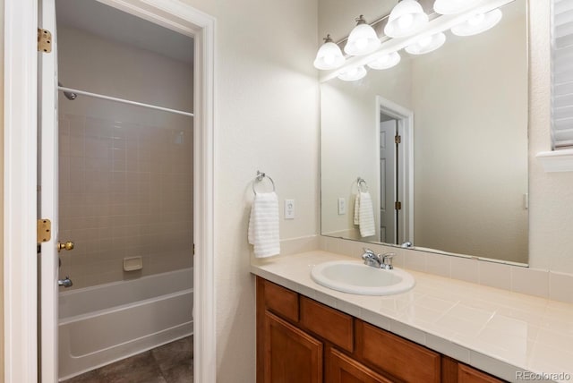 bathroom featuring vanity and bathing tub / shower combination