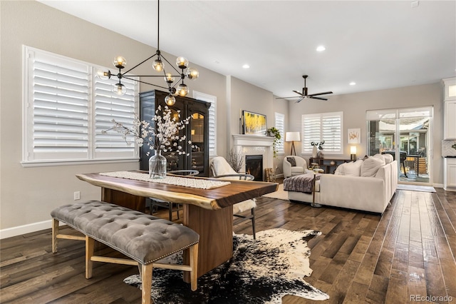 dining area featuring dark hardwood / wood-style floors and ceiling fan