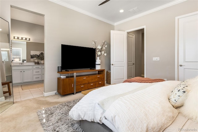 carpeted bedroom with sink, crown molding, ceiling fan, and ensuite bathroom