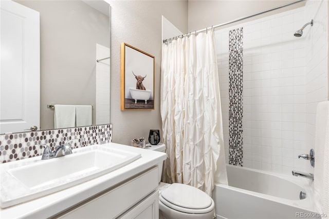 full bathroom with vanity, toilet, and shower / bath combo with shower curtain