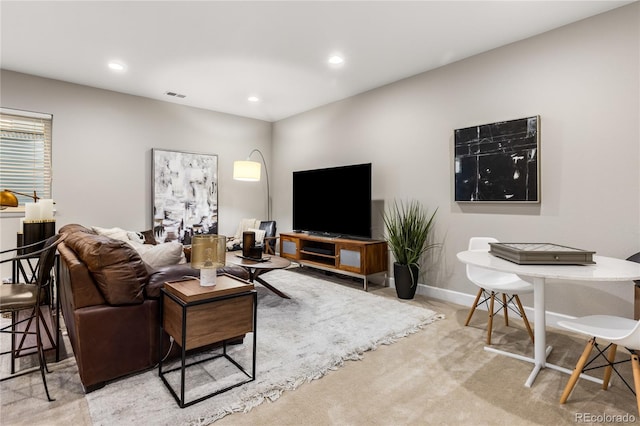 living room featuring light carpet