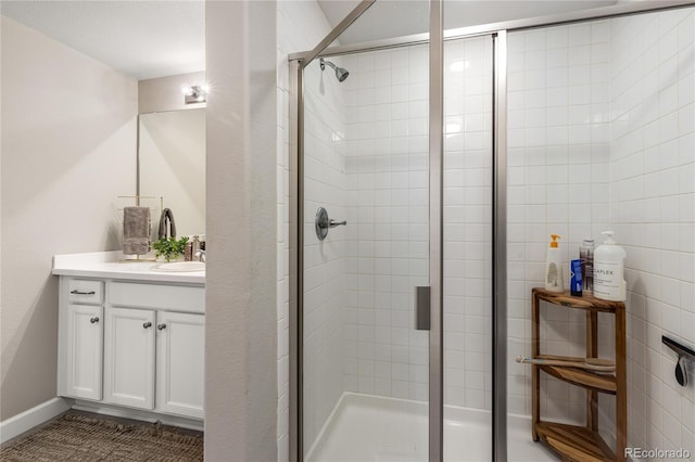 bathroom featuring vanity and walk in shower